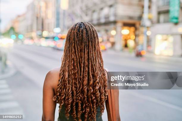 rear view of woman with cornrow braids walking in city - weaving stock pictures, royalty-free photos & images
