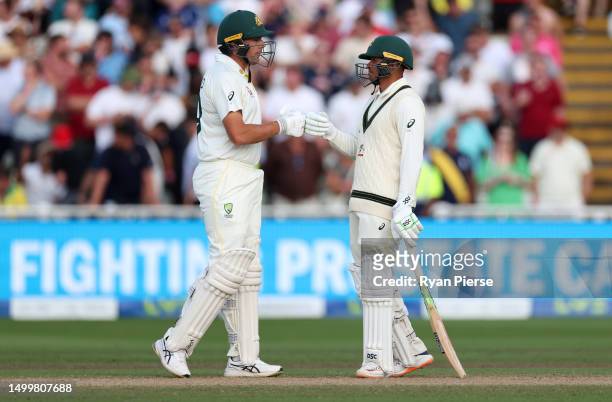 Scott Bolland of Australia and Usman Khawaja of Australia talk during Day Four of the LV= Insurance Ashes 1st Test match between England and...