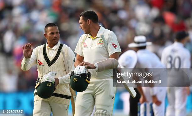 Usman Khawaja and Scott Boland of Australia interact following Day Four of the LV= Insurance Ashes 1st Test match between England and Australia at...