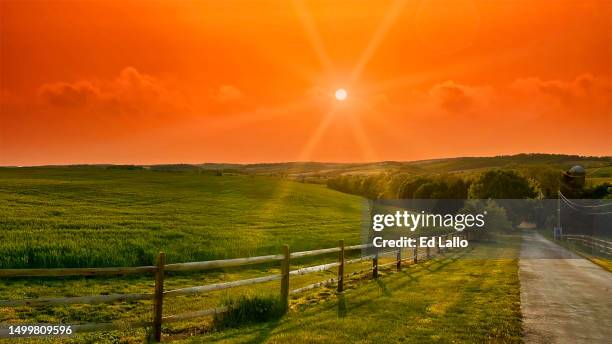 sunset over agricultural farmland and road - allentown pennsylvania stock pictures, royalty-free photos & images