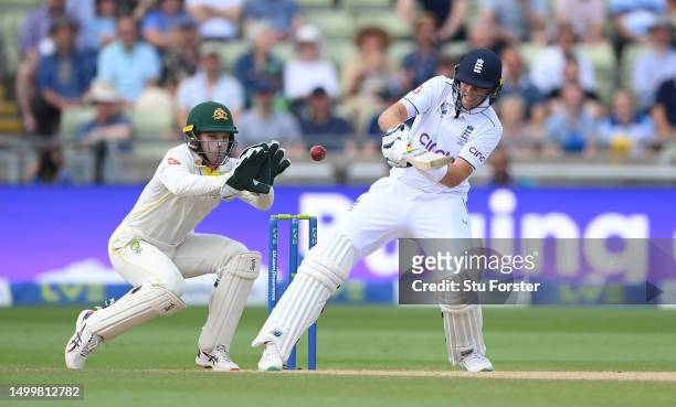 England batsman Joe Root reverse ramps a ball for 6 runs watched by Australia wicketkeeper Alex Carey during day four of the LV= Insurance Ashes 1st...