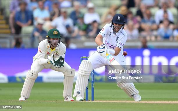 England batsman Joe Root reverse ramps a ball for 6 runs watched by Australia wicketkeeper Alex Carey during day four of the LV= Insurance Ashes 1st...