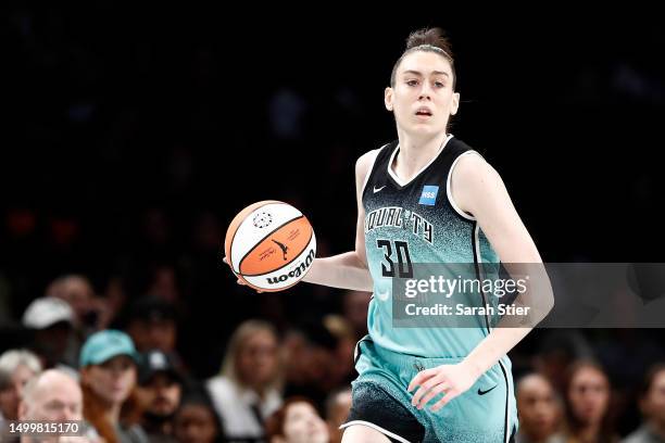 Breanna Stewart of the New York Liberty dribbles during the first half against the Phoenix Mercury at Barclays Center on June 18, 2023 in the...