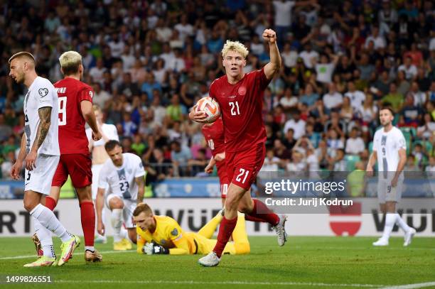 Rasmus Hojlund of Denmark celebrates after scoring the team's first goal during the UEFA EURO 2024 qualifying round group D match between Slovenia...