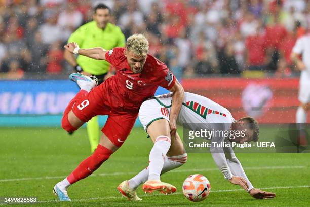 Alper Baris Yilmaz of Turkey and Chris Mepham of Wales battle for possession during the UEFA EURO 2024 qualifying round group D match between Turkey...