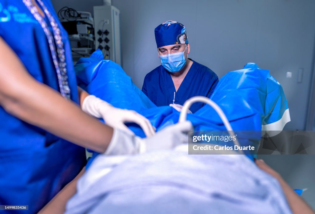 Embryo transfer. Placement of embryos from in vitro fertilization in the patient's uterus.