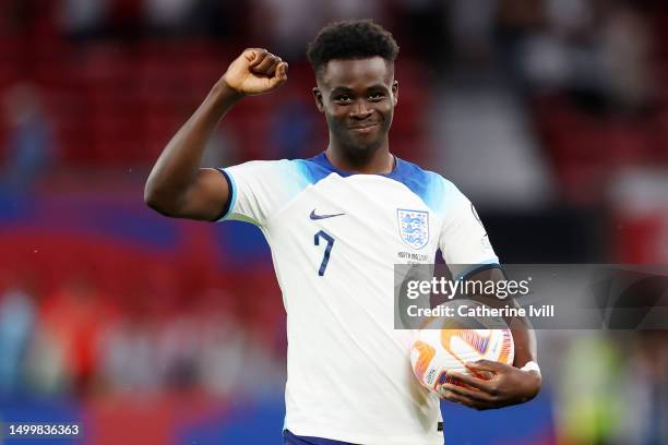 Bukayo Saka of England acknowledges the fans whilst carrying the match ball after scoring a hat-trick during the UEFA EURO 2024 qualifying round...
