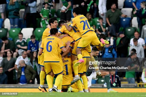 Players of Kazakhstan celebrate after the team's victory in the UEFA EURO 2024 qualifying round group D match between Northern Ireland and Kazakhstan...