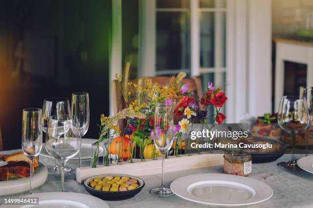 table served for garden party with apero. - apero stock pictures, royalty-free photos & images
