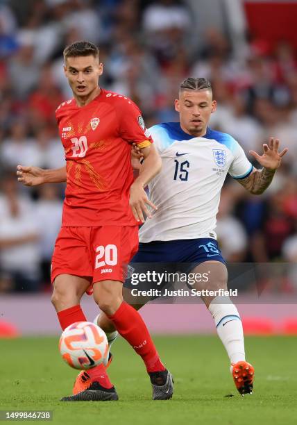 Kalvin Phillips of England and Dorian Babunski of North Macedonia during the UEFA EURO 2024 qualifying round group C match between England and North...