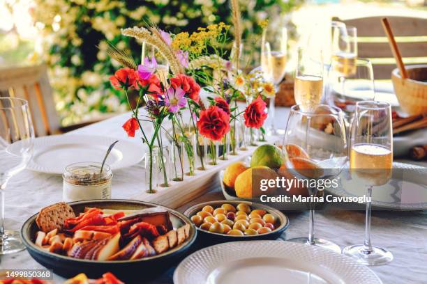 table served for garden party with apero. - apero stock pictures, royalty-free photos & images