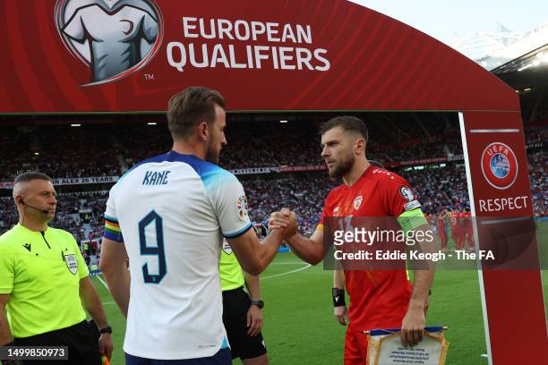 Harry Kane of England and Stefan Ristovski of North Macedonia shake hands prior to the UEFA EURO 2024 qualifying round group C match between England...