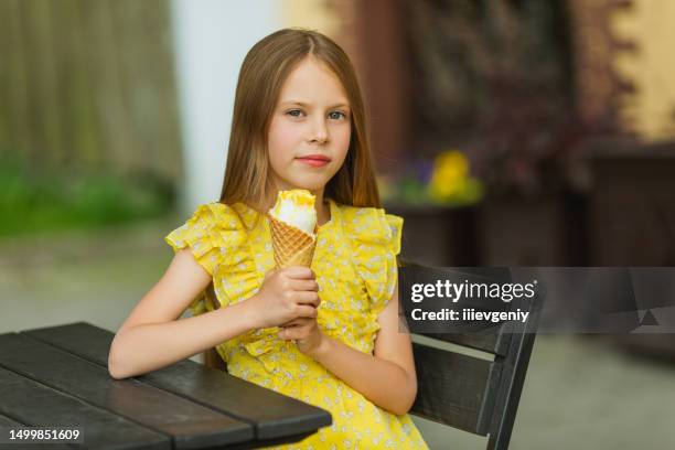 blonde girl in yellow dress with ice cream. summer lifestyle. childhood - long bright yellow dress stock pictures, royalty-free photos & images