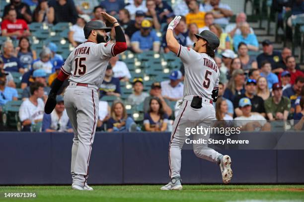 Alek Thomas of the Arizona Diamondbacks is congratulated by Emmanuel Rivera following a two run home run against the Milwaukee Brewers during the...