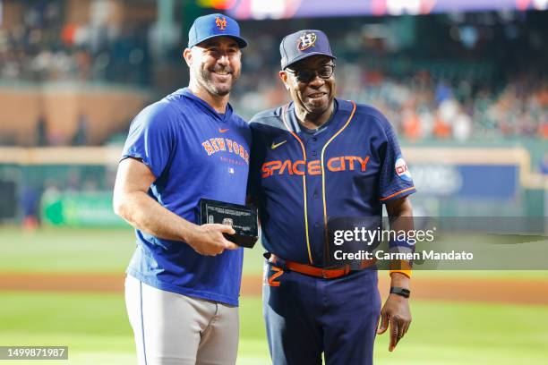 Justin Verlander of the New York Mets receives his World Series ring from Dusty Baker Jr. #12 of the Houston Astros at Minute Maid Park on June 19,...