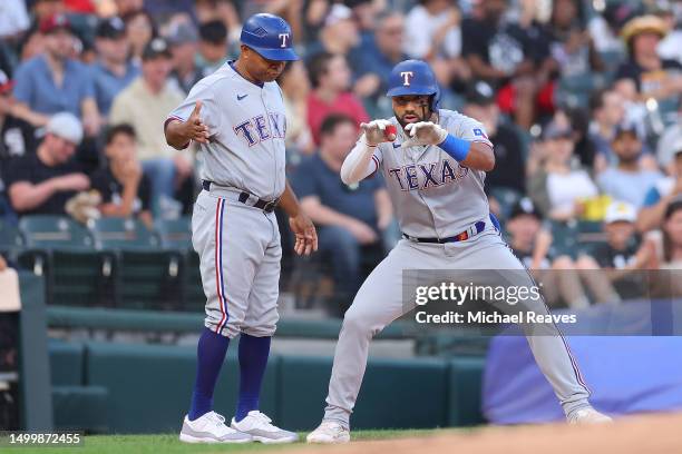 Ezequiel Duran of the Texas Rangers celebrates a triple against the Chicago White Sox during the second inning at Guaranteed Rate Field on June 19,...