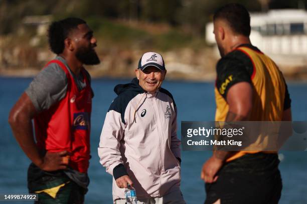 Wallabies head coach Eddie Jones talks to players during an Australian Wallabies training session at Coogee Beach on June 20, 2023 in Sydney,...