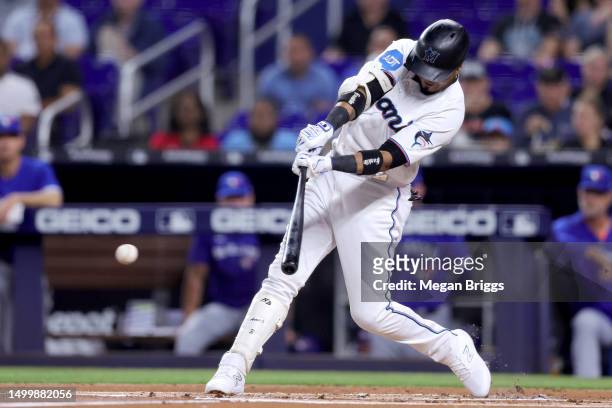 Luis Arraez of the Miami Marlins hits a single against the Toronto Blue Jays during the first inning at loanDepot park on June 19, 2023 in Miami,...