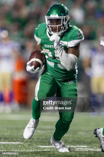 Jamal Morrow of the Saskatchewan Roughriders runs with the ball in the game between the Winnipeg Blue Bombers and Saskatchewan Roughriders at Mosaic...