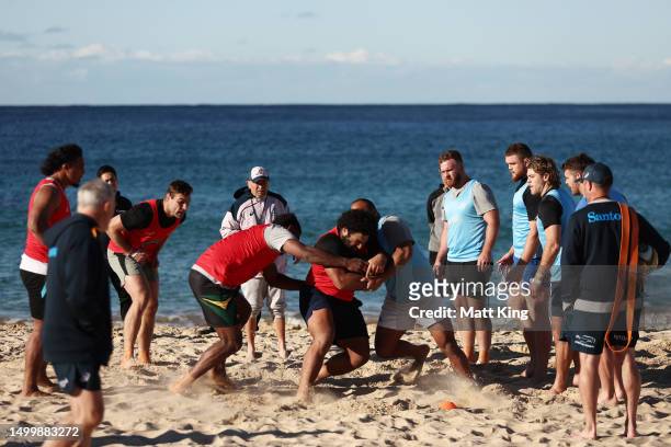 Wallabies head coach Eddie Jones looks on as players take part in a drill during an Australian Wallabies training session at Coogee Beach on June 20,...
