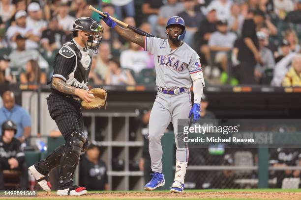 Adolis Garcia of the Texas Rangers reacts after striking out against the Chicago White Sox during the fourth inning at Guaranteed Rate Field on June...