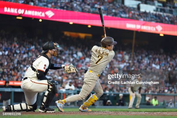 Ha-Seong Kim of the San Diego Padres hits a two-run single in the top of the fourth inning against the San Francisco Giants at Oracle Park on June...