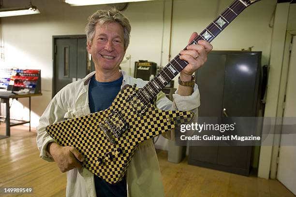 Frank Untermyer, current Vice President of KMC Music, holding a custom-built Hamer guitar at the Guild guitar factory. During a shoot for Guitarist...