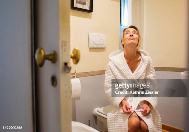 nervous woman waiting for  pregnancy test result - lazio medical tests stock pictures, royalty-free photos & images