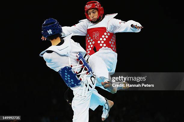 Daehoon Lee of Korea competes against Alexey Denisenko of Russia during the Men's -58kg semifinal Taekwondo match on Day 12 of the London 2012...