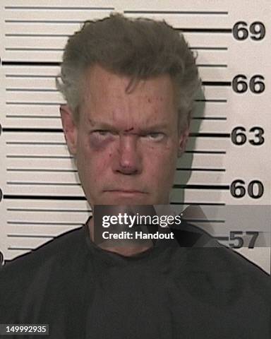 In this handout provided by the Grayson County Sheriff’s Office, musician Randy Travis is seen in a police booking photo August 7, 2012 in Sherman,...