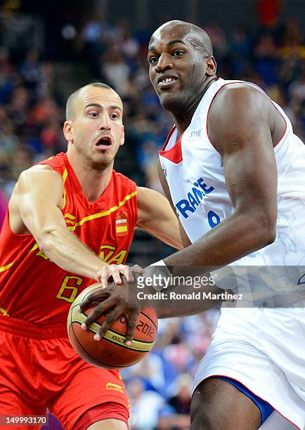 Ali Traore of France goes up for a shot against Sergio Rodriguez of Spain during the Men's Basketball quaterfinal game on Day 12 of the London 2012...