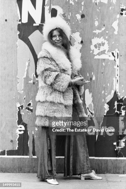 Blues singer Janis Joplin poses for a portrait on March 14, 1969 near her residence at the Hotel Chelsea in New York City, New York.