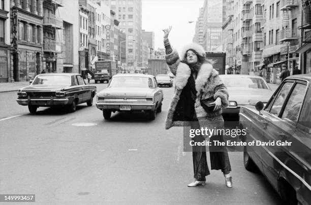 Blues singer Janis Joplin poses for a portrait on March 14, 1969 near her residence at the Hotel Chelsea in New York City, New York.