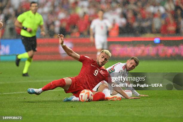 Alper Baris Yilmaz of Turkey and Chris Mepham of Wales battle for possession during the UEFA EURO 2024 qualifying round group D match between Turkey...