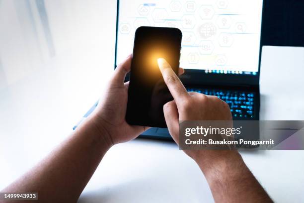 businessman hand working with mobile phone and laptop computer with technology digital graphic - interview icon stock pictures, royalty-free photos & images