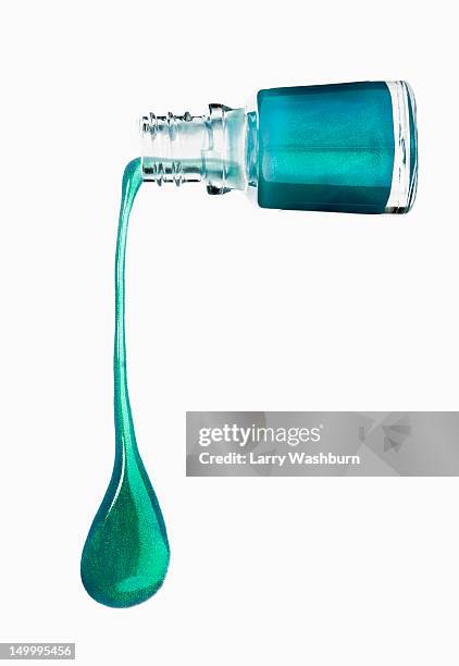 green nail polish dripping from a bottle - aqua nail polish stock pictures, royalty-free photos & images