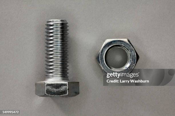 a bolt and a nut - screw stock pictures, royalty-free photos & images