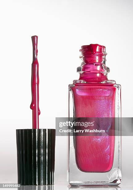 an open bottle of pink nail polish - nail polish bottle stock pictures, royalty-free photos & images