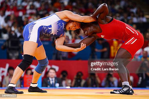 Isabelle Sambou of Senegal and Carol Huynh of Canada compete in the Women's Freestyle 48 kg Wrestling on Day 12 of the London 2012 Olympic Games at...