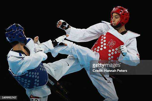 Daehoon Lee of Korea competes against Alexey Denisenko of Russia during the Men's -58kg semifinal Taekwondo match on Day 12 of the London 2012...