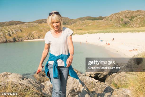 having fun above achmelvich beach, lochinver, scotland - achmelvich stock pictures, royalty-free photos & images