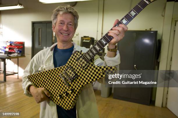 Frank Untermyer, current Vice President of KMC Music, holding a custom-built Hamer guitar at the Guild guitar factory. During a shoot for Guitarist...
