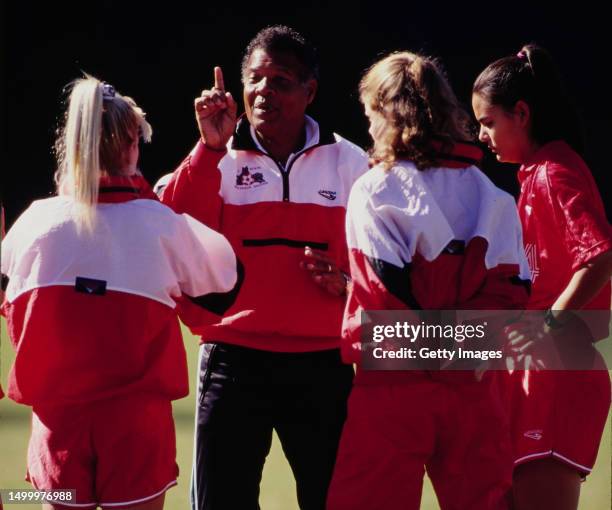 Alvin Corneal from Trinidad and Tobago, Head Coach for the NCAA Division I North Carolina State Wolfpack Women's Soccer Team gives instructions to...