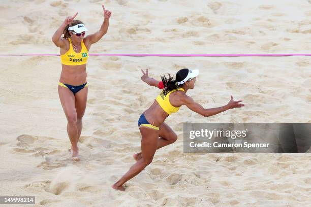 Juliana Silva and Larissa Franca of Brazil celebrate during the Women's Beach Volleyball Bronze medal match against China on Day 12 of the London...