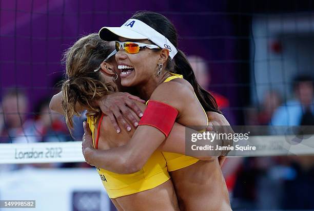 Larissa Franca and Juliana Silva of Brazil celebrate winning the Bronze medal in the Women's Beach Volleyball Bronze medal match against China on Day...