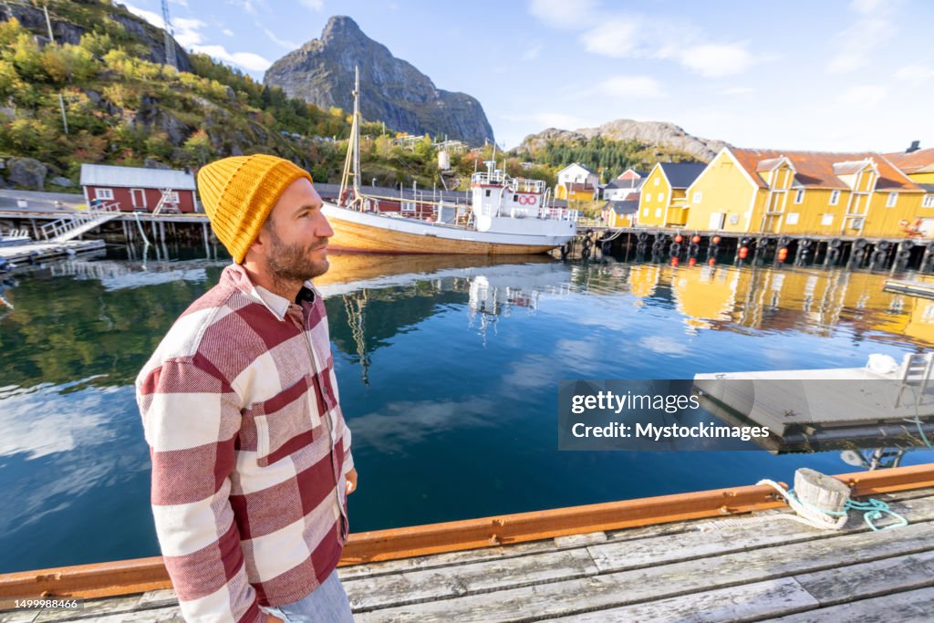 Man visiting a typical Norwegian fisherman's village