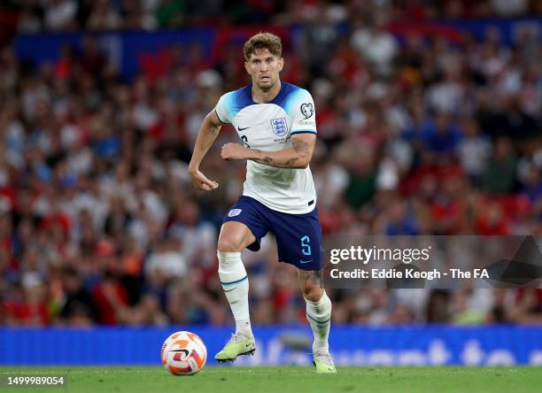 John Stones of England runs with the ball during the UEFA EURO 2024 qualifying round group C match between England and North Macedonia at Old...