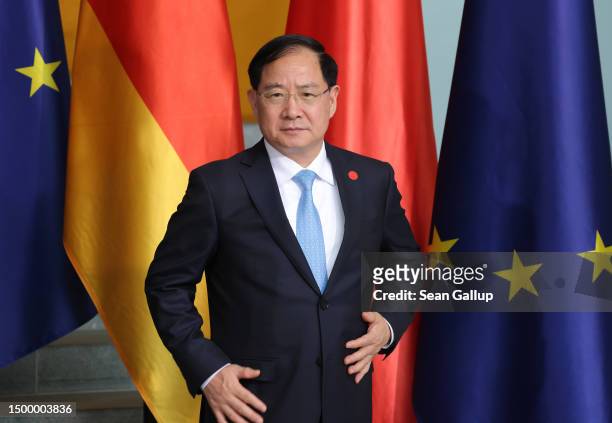 Chinese Minister of Industry and Information Technology Jin Zhuanglong arrives for a group photo of the German and Chinese government cabinets at the...