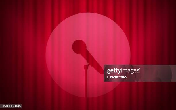 microphone stage performance red curtain background - stand up comedy stock illustrations