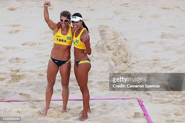 Larissa Franca and Juliana Silva of Brazil celebrate winning the Bronze medal in the Women's Beach Volleyball Bronze medal match against China on Day...